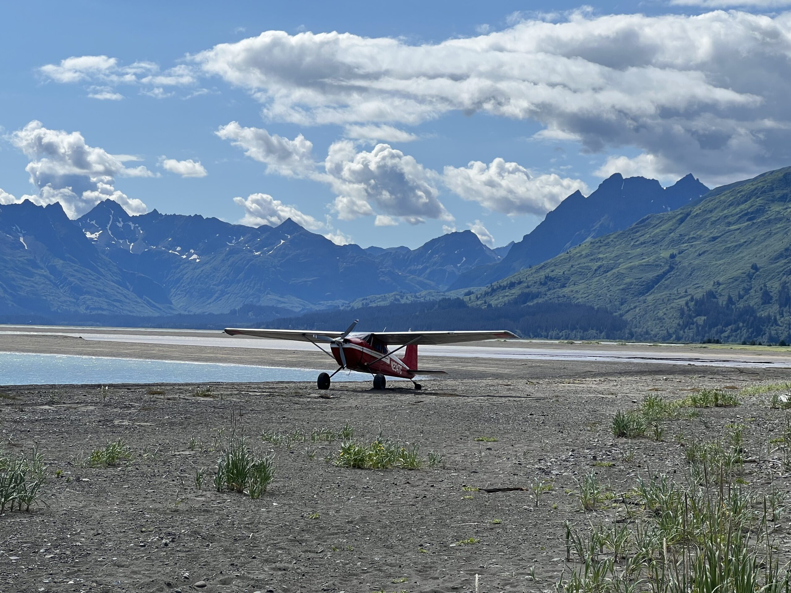 IMG_5229 The Fly 907 air plane resting on the ground with the Alaskan mountains in the background
